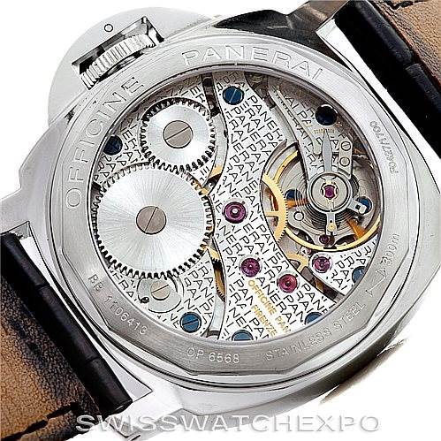 The image shows the back of a Panerai Luminor PAM114 Men
s Stainless Steel White Dial PAM114 Men
s Stainless Steel White Dial watch, highlighting its exposed mechanical movement and intricate components.