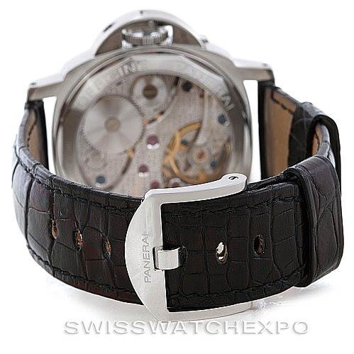 The image shows the back view of a Panerai Luminor PAM114 Men
s Stainless Steel White Dial PAM114 Men
s Stainless Steel White Dial watch, displaying its transparent case back and leather strap with a buckle.
