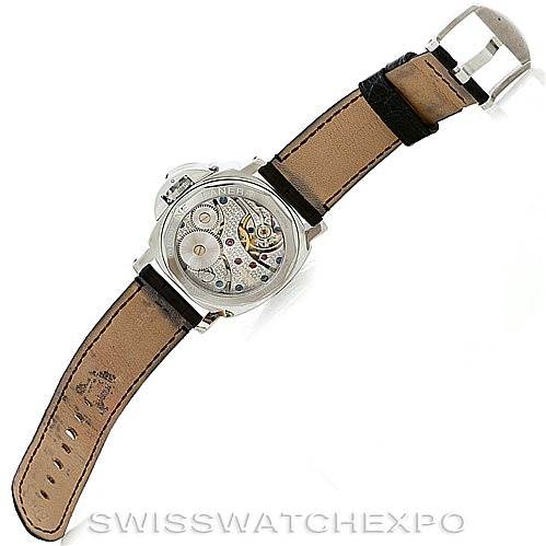 The image shows the back view of a Panerai Luminor PAM114 Men
s Stainless Steel White Dial PAM114 Men
s Stainless Steel White Dial watch, highlighting its mechanical movement and leather strap.