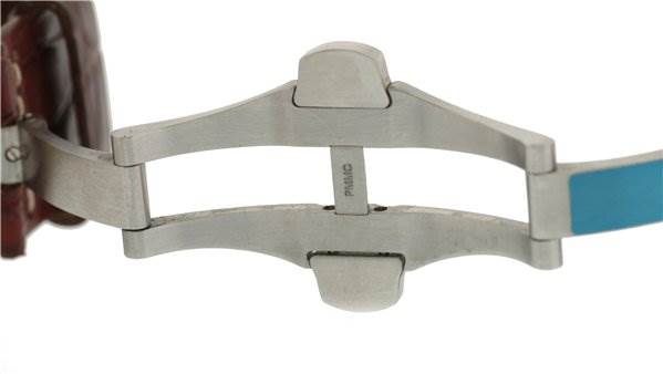 This close-up image shows the butterfly clasp of a Panerai Luminor PAM88 Men's Stainless Steel Black Dial PAM88 Men's Stainless Steel Black Dial watch, highlighting its stainless steel construction.