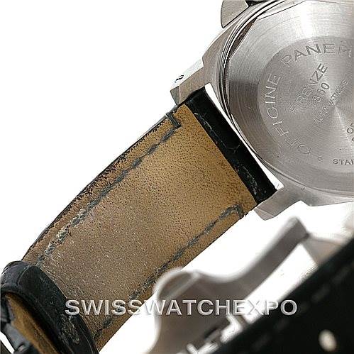 The image shows the back of a Panerai Luminor PAM119 Men
s Stainless Steel Blue Dial PAM119 Men
s Stainless Steel Blue Dial watch, focusing on the case back and partially worn leather strap.