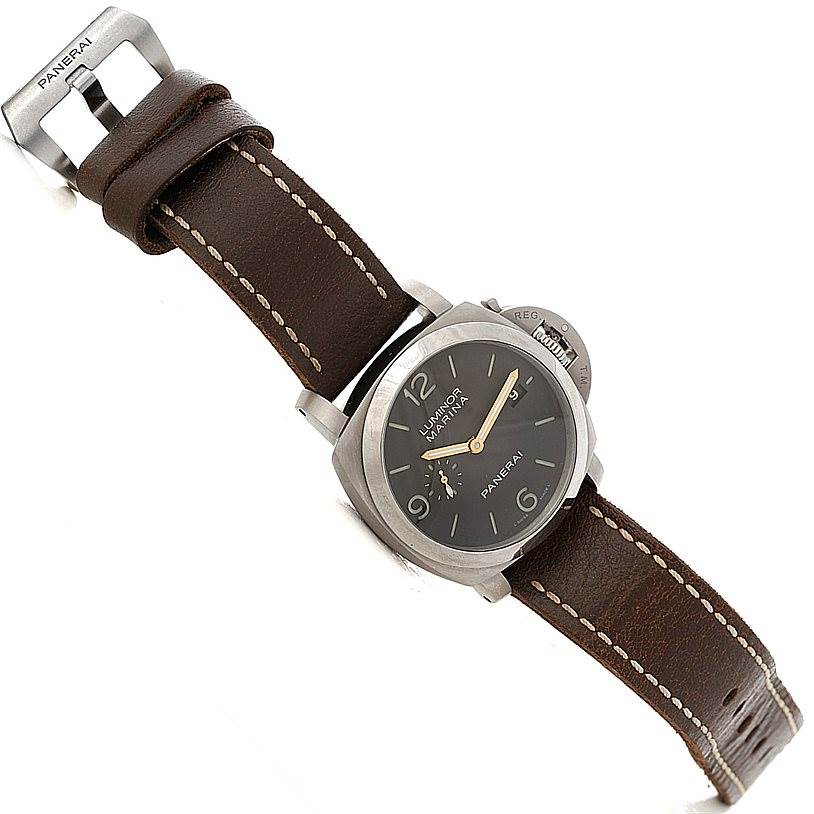 The Panerai Luminor PAM00351 Men's Titanium Brown Dial PAM00351 Men's Titanium Brown Dial watch is displayed at a slight diagonal angle, showing the face, leather strap, and buckle.