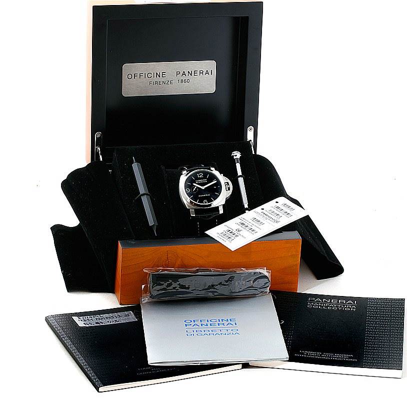 The image shows the Luminor model by Panerai in its case, with additional straps, tools, and manuals displayed at an angled front view. 