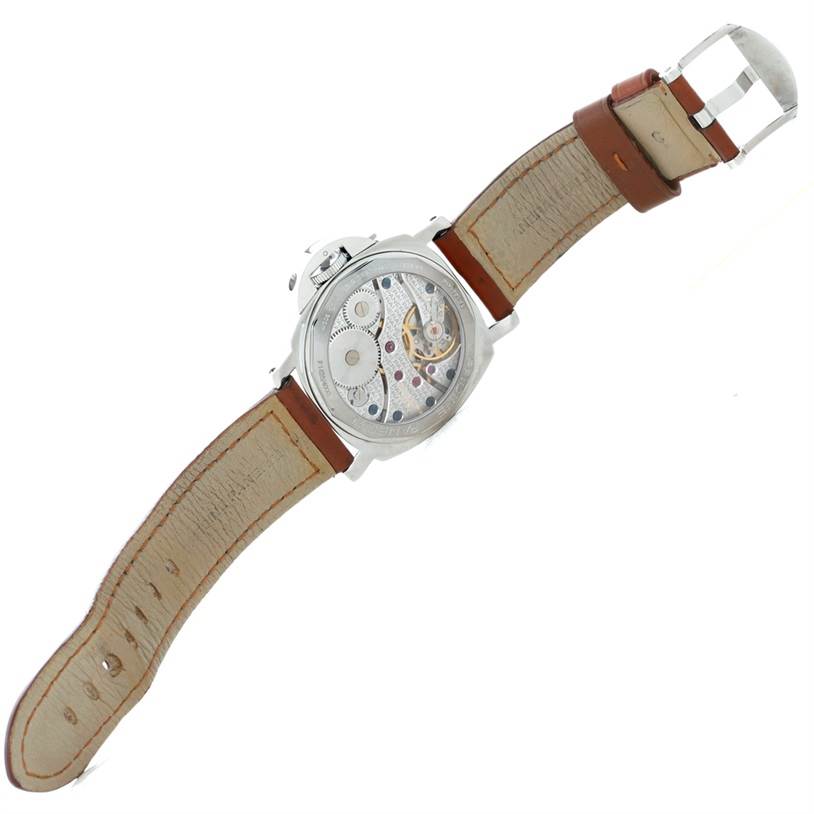 The image shows the back view of a Panerai Luminor PAM00111 Men's Stainless Steel Black Dial PAM00111 Men's Stainless Steel Black Dial watch, displaying the internal mechanical movement and leather strap.