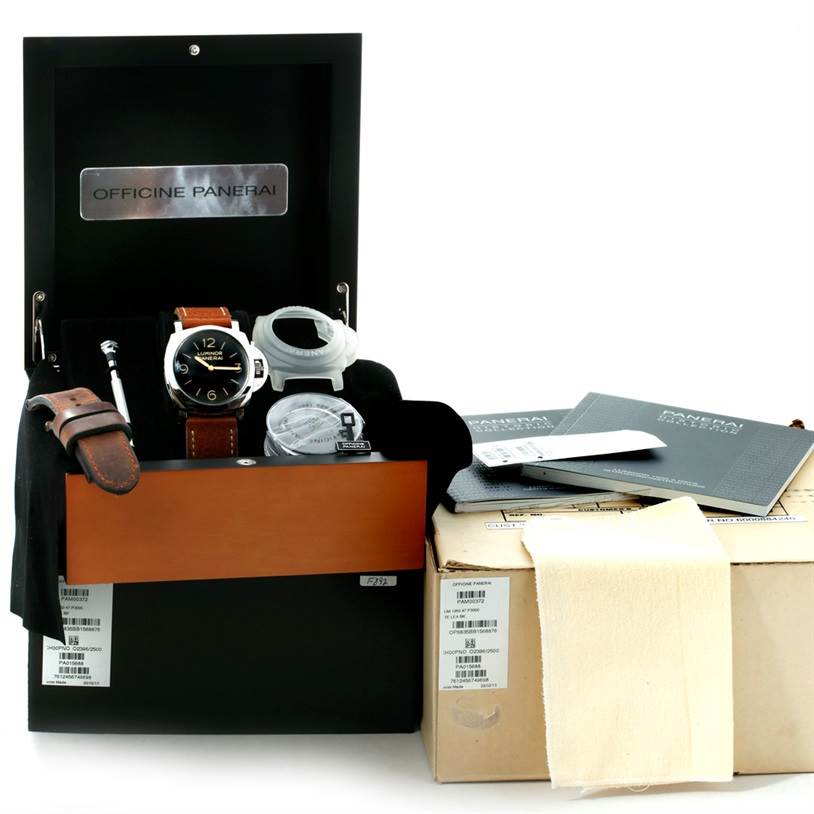 The image shows a Panerai Luminor PAM00372 Men
s Stainless Steel Black Dial PAM00372 Men
s Stainless Steel Black Dial watch with accessories including straps, a tool, and documentation, presented from a front angle.