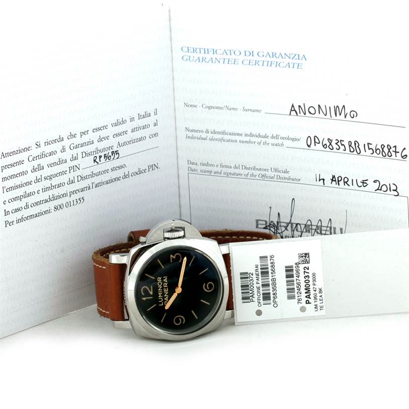 The photo shows the Panerai Luminor PAM00372 Men
s Stainless Steel Black Dial PAM00372 Men
s Stainless Steel Black Dial watch from a front angle, along with its brown leather strap and warranty certificate.