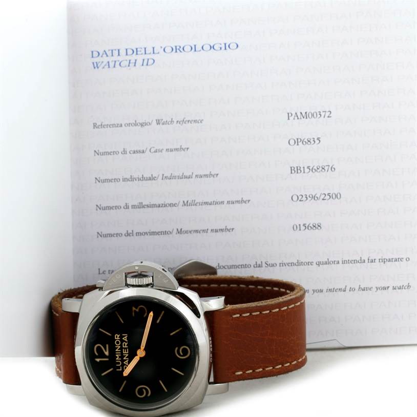 This image shows the front and side angles of a Panerai Luminor PAM00372 Men
s Stainless Steel Black Dial PAM00372 Men
s Stainless Steel Black Dial watch with its official identification document in the background.