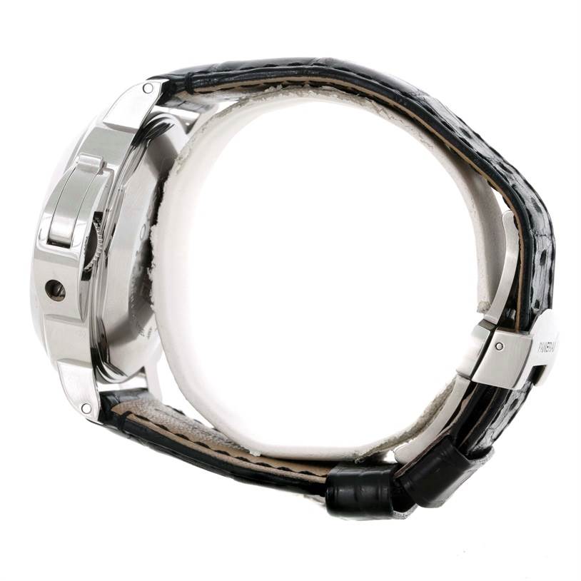 This side view of the Panerai Luminor PAM00090 Men's Stainless Steel Black Dial PAM00090 Men's Stainless Steel Black Dial watch shows the case, crown guard, and part of the leather strap with the buckle.
