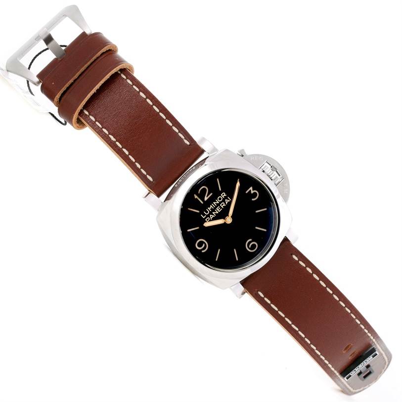 The Panerai Luminor PAM00372 Men's Stainless Steel Black Dial PAM00372 Men's Stainless Steel Black Dial watch is shown from an angled top view, showcasing its black dial, silver case, and brown leather strap.