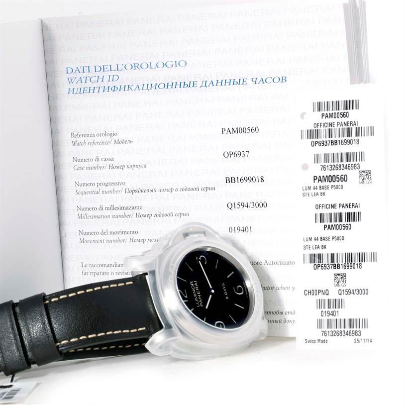 The image shows a Panerai Luminor PAM00560 Men
s Stainless Steel Black Dial PAM00560 Men
s Stainless Steel Black Dial watch in a protective case, viewed from an angled top-down perspective, with accompanying documentation.