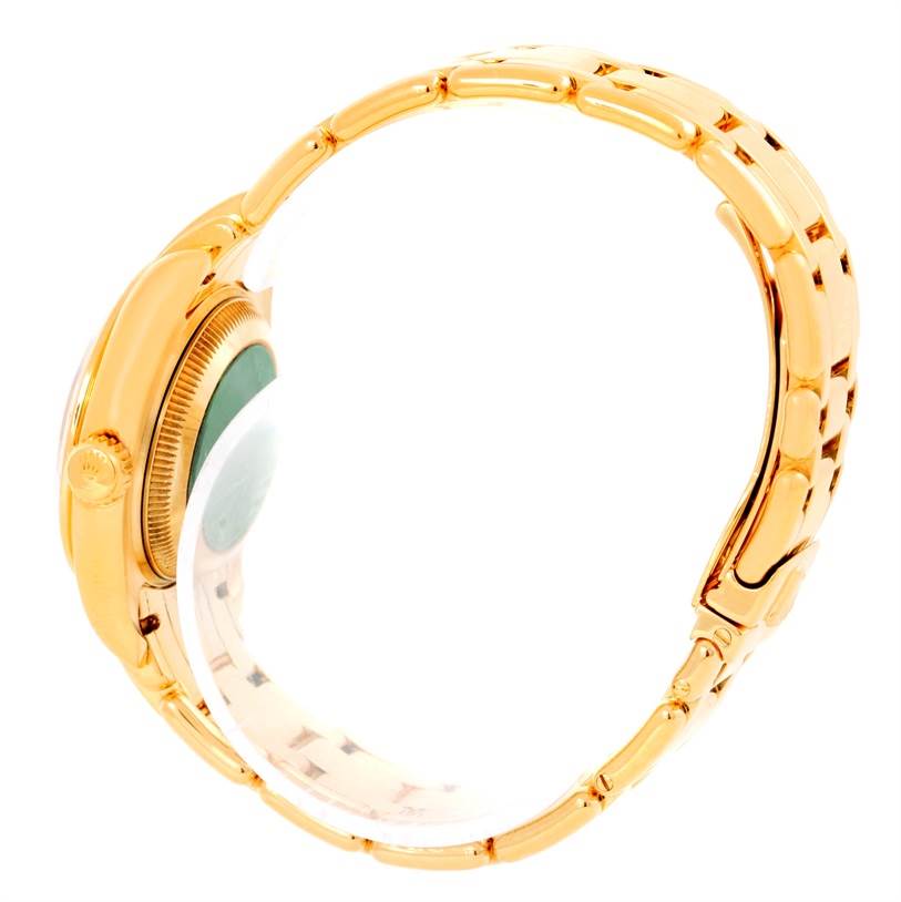 The image shows a side profile of a Rolex Pearlmaster 69298 Women's Yellow Gold Mother of Pearl Dial 69298 Women's Yellow Gold Mother of Pearl Dial watch, highlighting the gold case, crown, and bracelet.