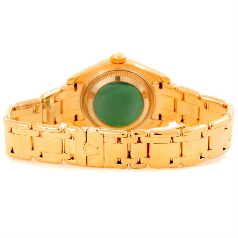 The image shows the back view of a Rolex Pearlmaster 69298 Women's Yellow Gold Mother of Pearl Dial 69298 Women's Yellow Gold Mother of Pearl Dial watch, highlighting its gold bracelet and case back.