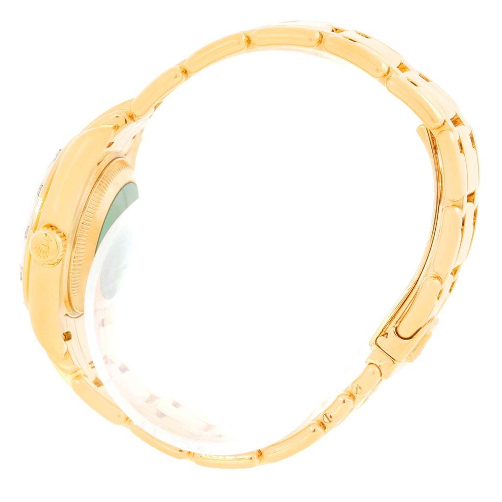 The image shows a side view of a Rolex Pearlmaster 69318 Women's Yellow Gold White Dial 69318 Women's Yellow Gold White Dial, featuring the crown, case, and bracelet.