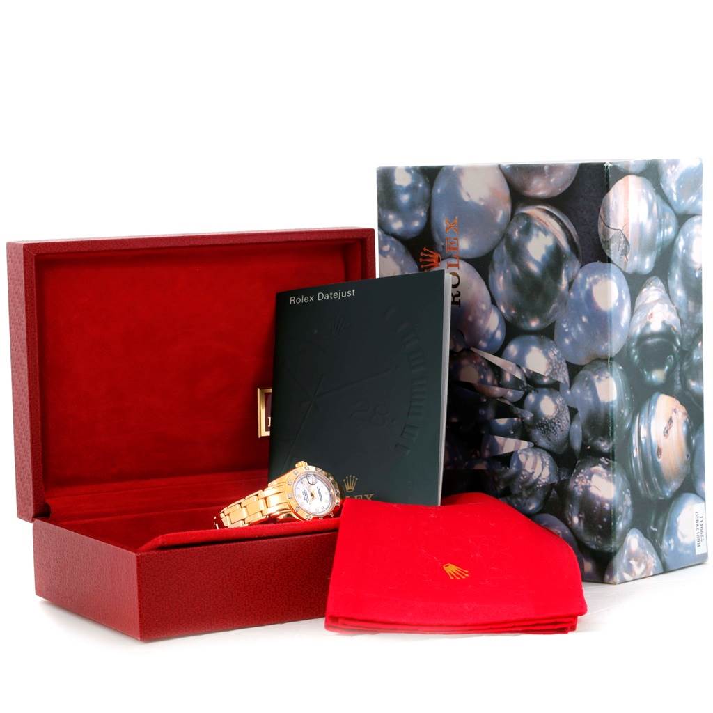 The image shows a Rolex Pearlmaster 69318 Women's Yellow Gold White Dial 69318 Women's Yellow Gold White Dial watch in a red presentation box with accompanying paperwork and a decorative outer box.