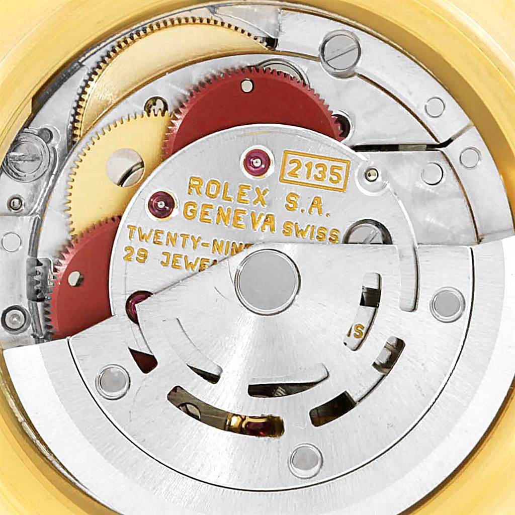 This image shows the internal mechanism of the Rolex Pearlmaster 69318 Women's Yellow Gold White Dial 69318 Women's Yellow Gold White Dial watch model 2135, including gears and movement components.