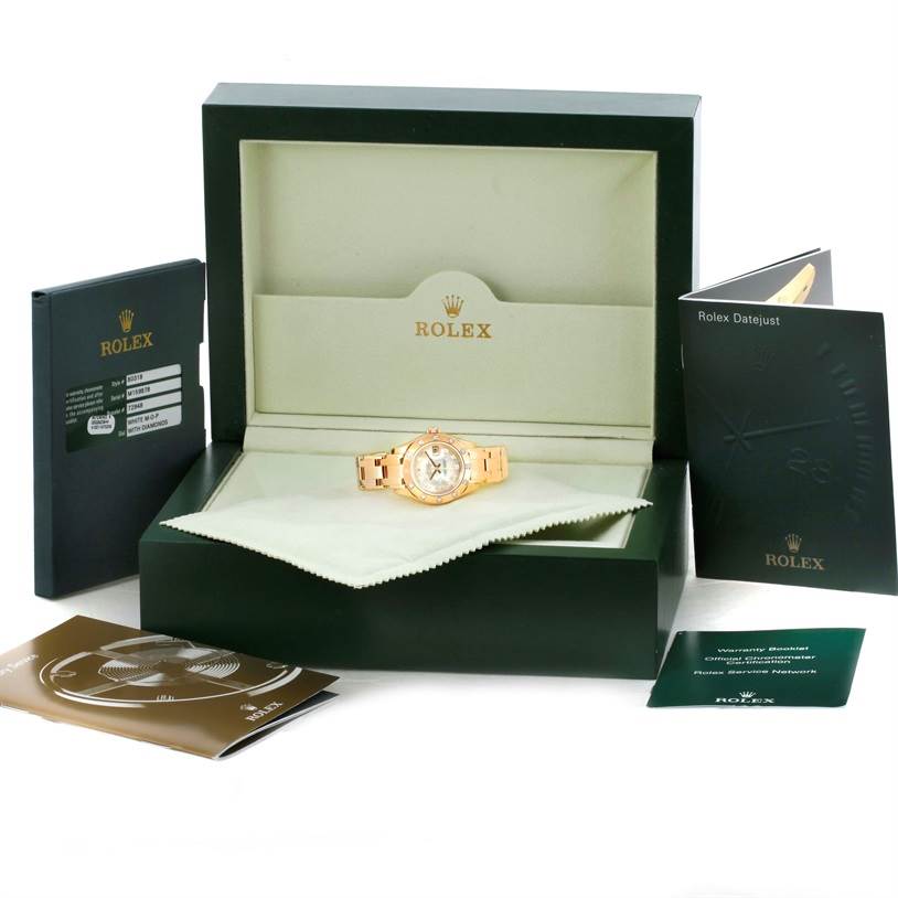 This image shows a Rolex Pearlmaster 80318 Women's Yellow Gold Mother of Pearl Dial 80318 Women's Yellow Gold Mother of Pearl Dial watch displayed in its open box with accompanying booklets and documents.