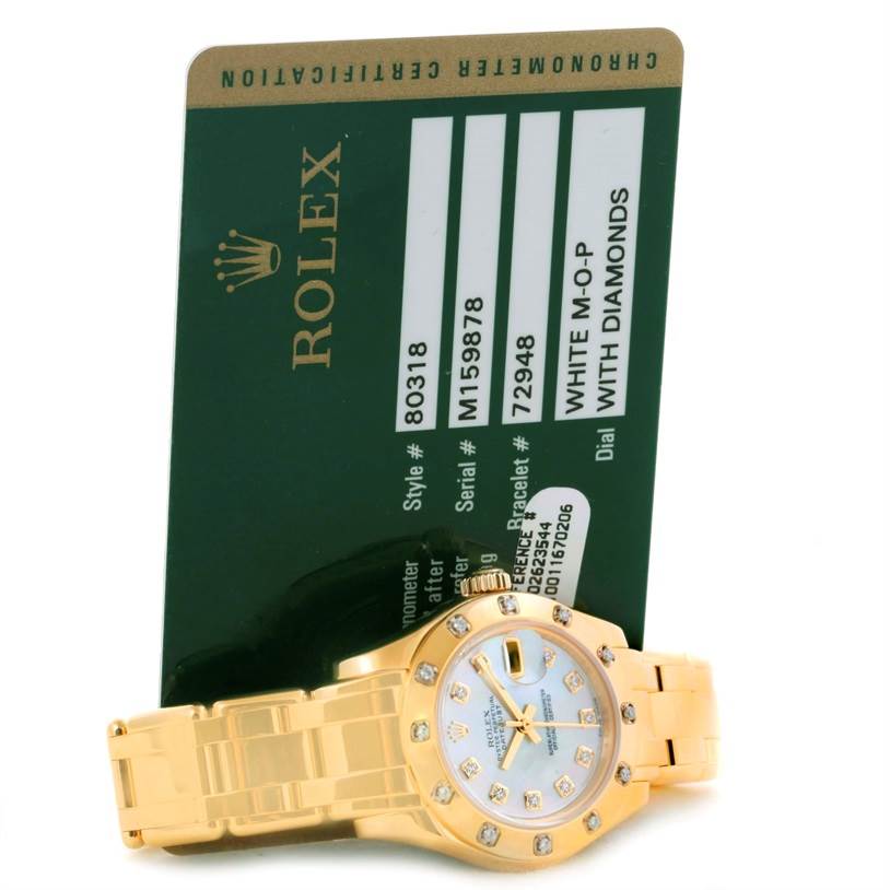 The image shows the face and bracelet of a Rolex Pearlmaster 80318 Women's Yellow Gold Mother of Pearl Dial 80318 Women's Yellow Gold Mother of Pearl Dial watch with an accompanying authentication card in the background.