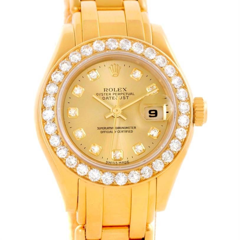 The image shows a front view of a Rolex Pearlmaster 69298 Women's Yellow Gold Champagne Dial 69298 Women's Yellow Gold Champagne Dial watch, highlighting its diamond-encrusted bezel, gold dial, and bracelet.