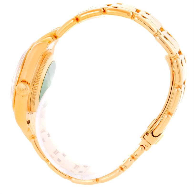 The image displays a side view of the Rolex Pearlmaster 69298 Women's Yellow Gold Champagne Dial 69298 Women's Yellow Gold Champagne Dial watch, highlighting its golden case, crown, and bracelet.