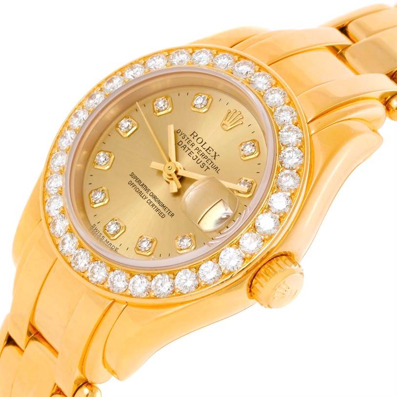 The image shows a close-up, angled view of a Rolex Pearlmaster 69298 Women's Yellow Gold Champagne Dial 69298 Women's Yellow Gold Champagne Dial watch, highlighting its diamond-studded bezel, gold case, and bracelet.