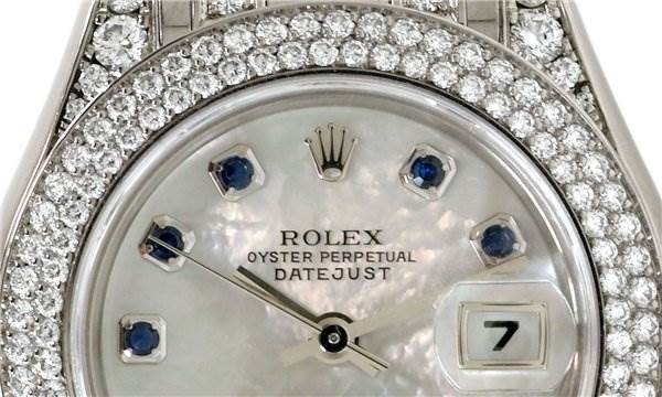 The image shows a close-up of the dial and bezel of a Rolex Pearlmaster 80359 Women's White Gold Mother of Pearl Dial 80359 Women's White Gold Mother of Pearl Dial watch, highlighting the diamonds and sapphire hour markers.