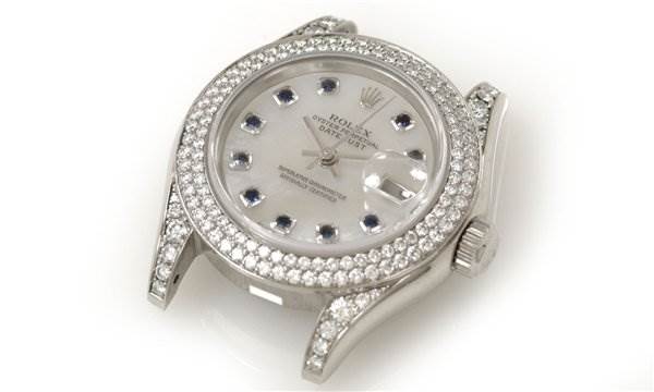 This Rolex Pearlmaster 80359 Women's White Gold Mother of Pearl Dial 80359 Women's White Gold Mother of Pearl Dial watch is shown from a slightly angled top-down view, displaying the bezel, dial, and case.