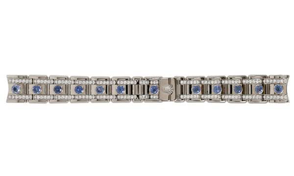 The image shows a top view of a Rolex Pearlmaster 80359 Women's White Gold Mother of Pearl Dial 80359 Women's White Gold Mother of Pearl Dial watch bracelet featuring blue sapphires and diamonds.