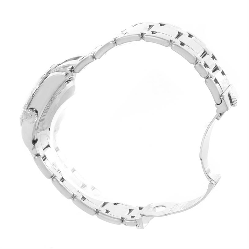 The Rolex Pearlmaster 80319 Women's White Gold Mother of Pearl Dial 80319 Women's White Gold Mother of Pearl Dial watch is shown from a side angle, displaying the bracelet and the case with the crown.