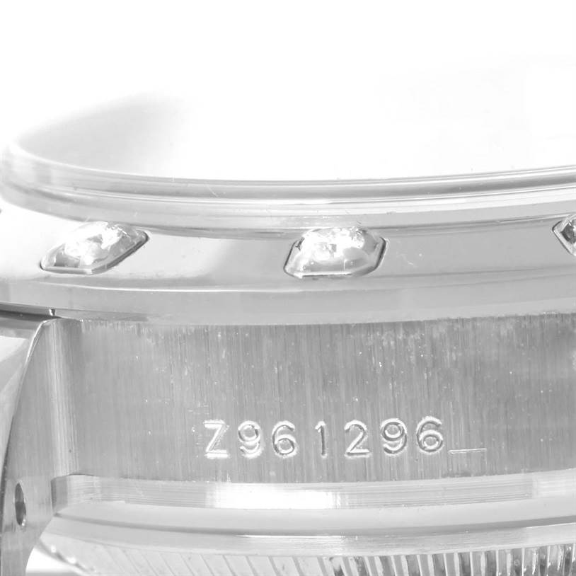 This image shows a close-up of the side view of a Rolex Pearlmaster 80319 Women's White Gold Mother of Pearl Dial 80319 Women's White Gold Mother of Pearl Dial watch, highlighting the bezel and serial number.