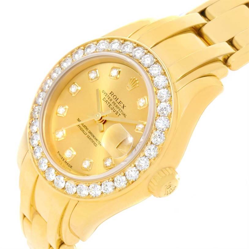 This image shows a close-up, angled view of the Rolex Pearlmaster 80298 Women's Yellow Gold Champagne Dial 80298 Women's Yellow Gold Champagne Dial watch, highlighting its diamond bezel, gold dial, and bracelet.