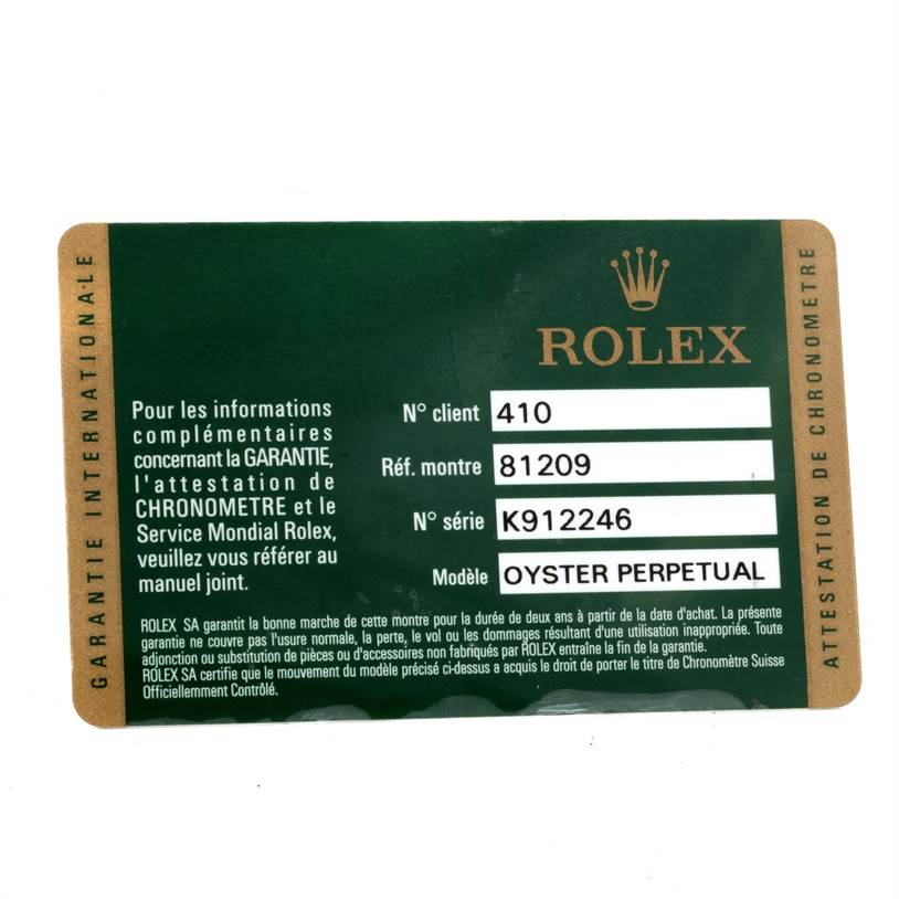 This image shows a warranty card for a Rolex watch, describing a model from the Oyster Perpetual collection.