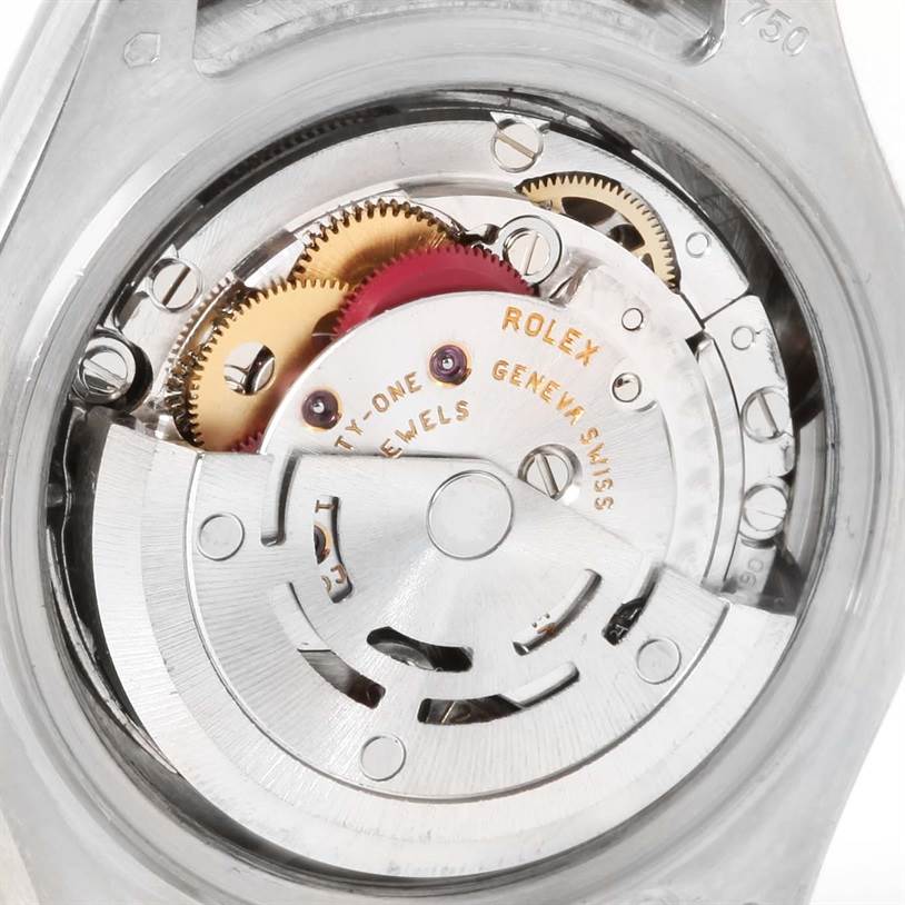 This close-up image shows the inner mechanism of a Rolex Pearlmaster 80299 Women's White Gold Mother of Pearl Dial 80299 Women's White Gold Mother of Pearl Dial watch, including gears and the movement parts.