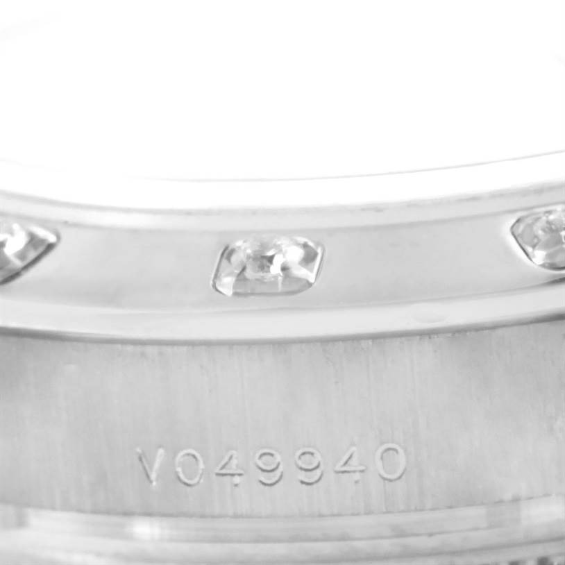 This close-up image shows the diamond-set bezel and part of the case with the serial number of the Rolex Pearlmaster 80319 Women's White Gold White Dial 80319 Women's White Gold White Dial watch.