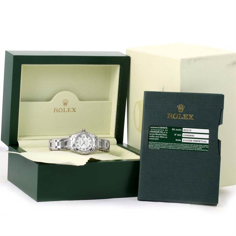 The image shows a Rolex Pearlmaster 80319 Women's White Gold White Dial 80319 Women's White Gold White Dial in its box, along with its warranty card and documentation.
