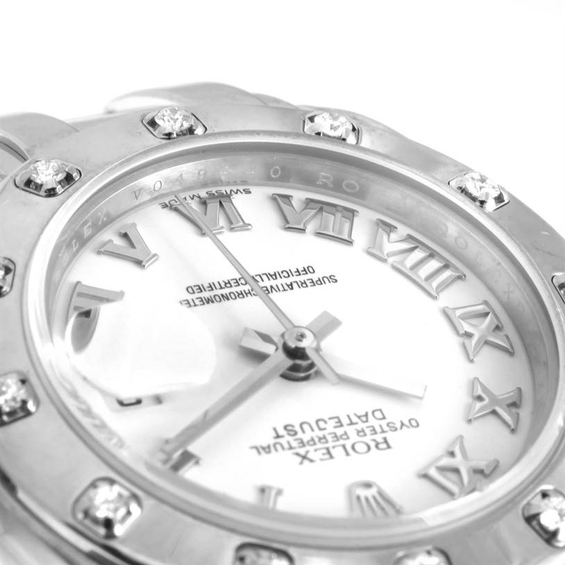 The image shows a close-up view of the Rolex Pearlmaster 80319 Women's White Gold White Dial 80319 Women's White Gold White Dial watch face and diamond-studded bezel.