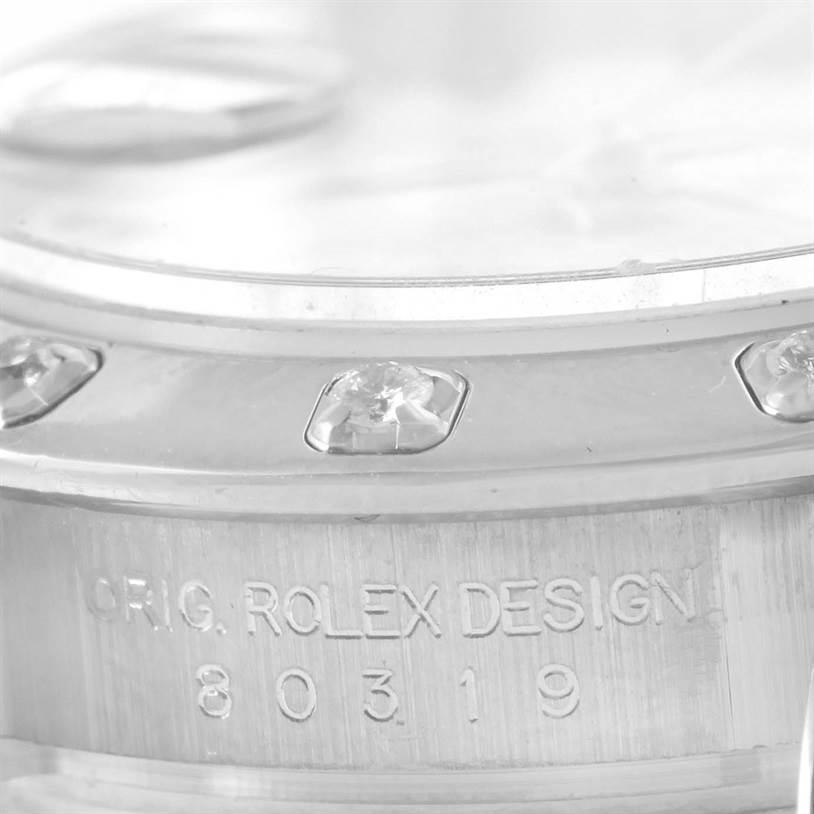 The image shows a close-up angle of the bezel and part of the case of a Rolex Pearlmaster 80319 Women's White Gold White Dial 80319 Women's White Gold White Dial watch, including the engraved model number "80319."