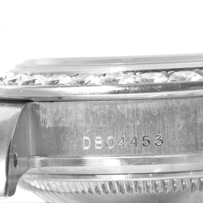 This image shows a close-up of the side of a Rolex Pearlmaster 80299 Women's White Gold Mother of Pearl Dial 80299 Women's White Gold Mother of Pearl Dial watch, focusing on the bezel and serial number.