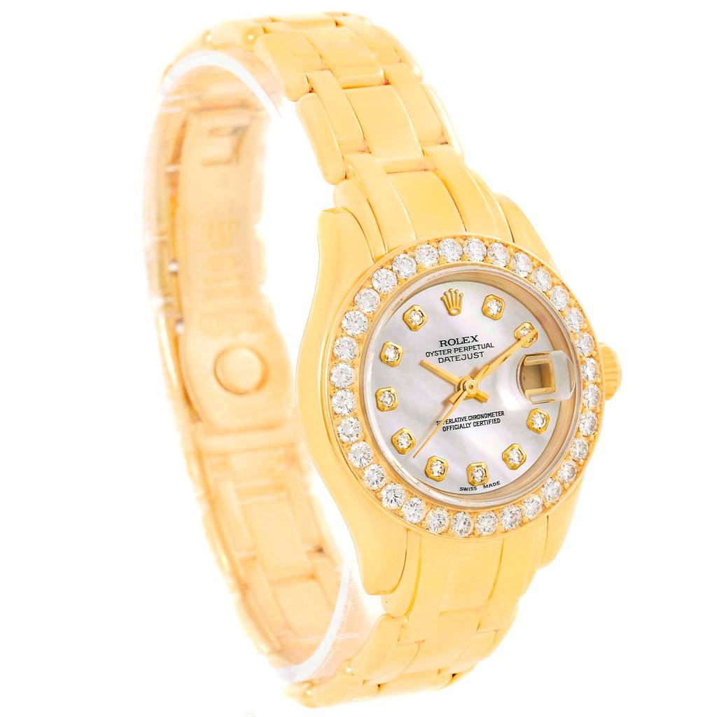 This Rolex Pearlmaster 69298 Women's Yellow Gold Mother of Pearl Dial 69298 Women's Yellow Gold Mother of Pearl Dial watch is shown at a slight angle, displaying its gold bracelet, diamond bezel, and mother-of-pearl dial.