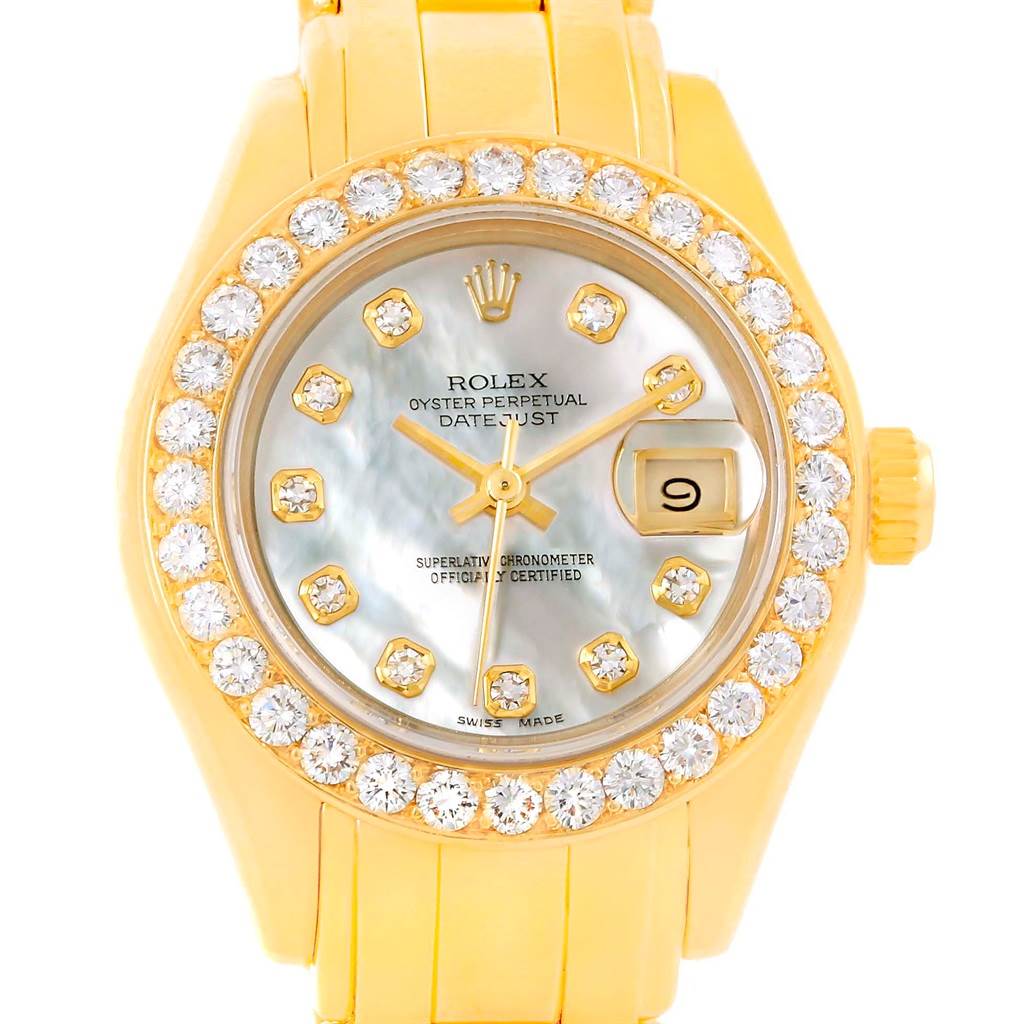 The image shows a front view of a Rolex Pearlmaster 69298 Women's Yellow Gold Mother of Pearl Dial 69298 Women's Yellow Gold Mother of Pearl Dial watch featuring a diamond-studded bezel and bracelet, with a date window at 3 o'clock.