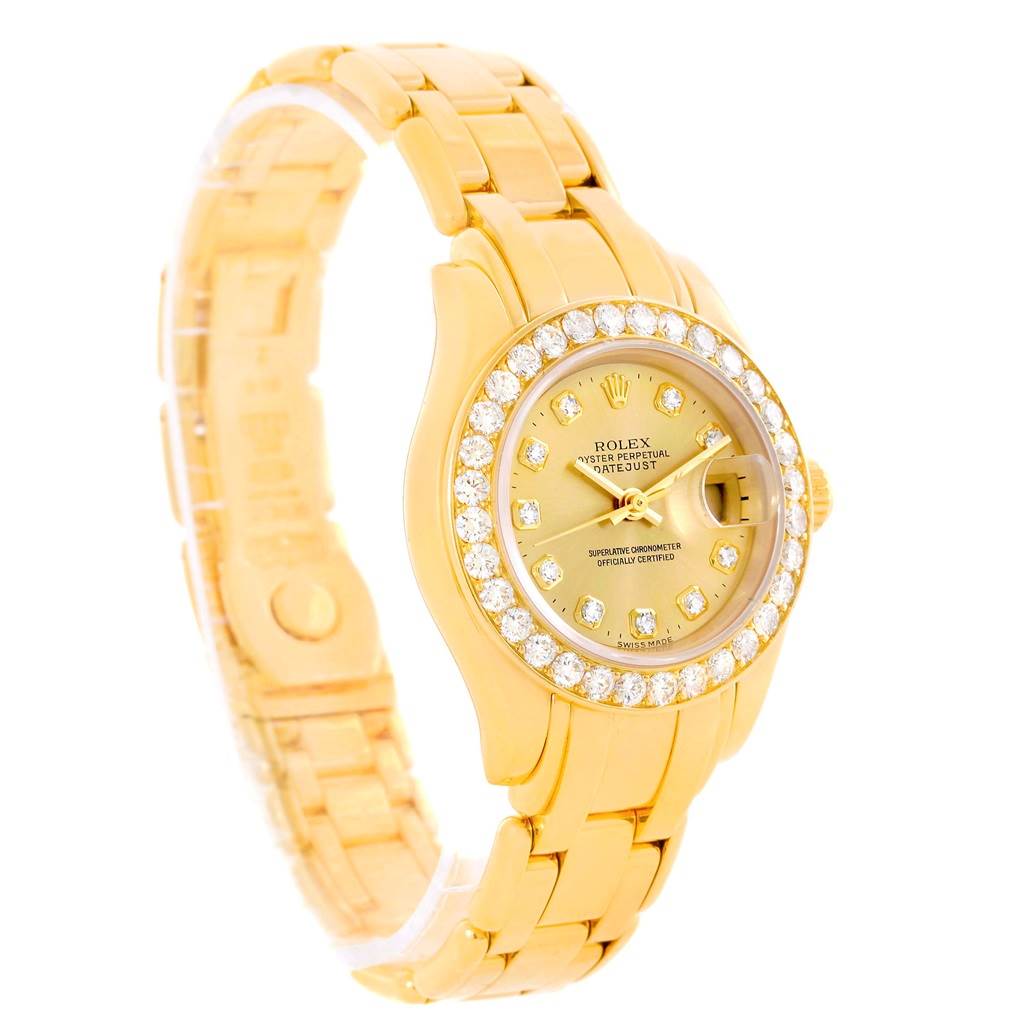 The image shows a side view of the Rolex Pearlmaster 69298 Women's Yellow Gold Champagne Dial 69298 Women's Yellow Gold Champagne Dial watch, highlighting its gold bracelet, diamond-encrusted bezel, and face.