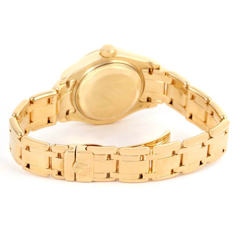 This image shows the backside and the bracelet of a Rolex Pearlmaster 69298 Women's Yellow Gold Champagne Dial 69298 Women's Yellow Gold Champagne Dial watch with the clasp partially open.