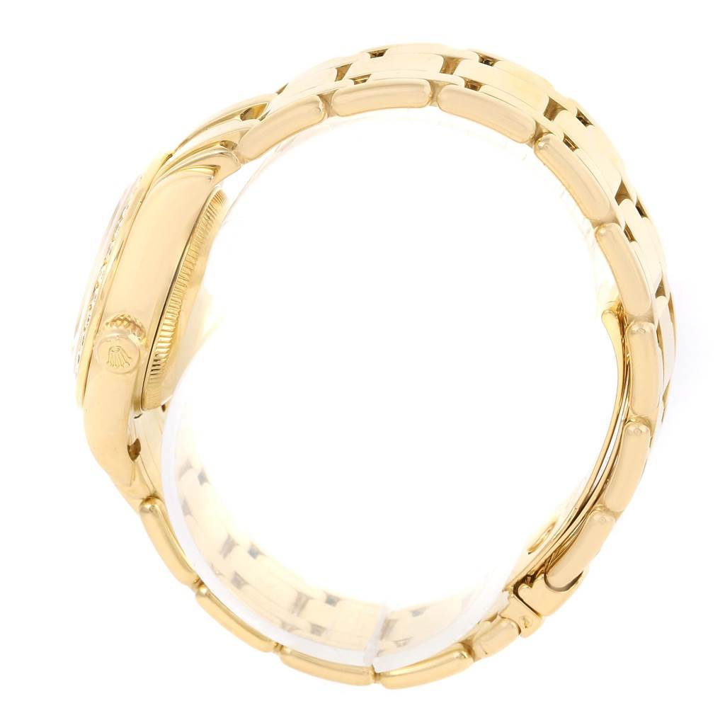 This image shows a side view of the Rolex Pearlmaster 69298 Women's Yellow Gold Champagne Dial 69298 Women's Yellow Gold Champagne Dial watch, focusing on the case and part of the bracelet.