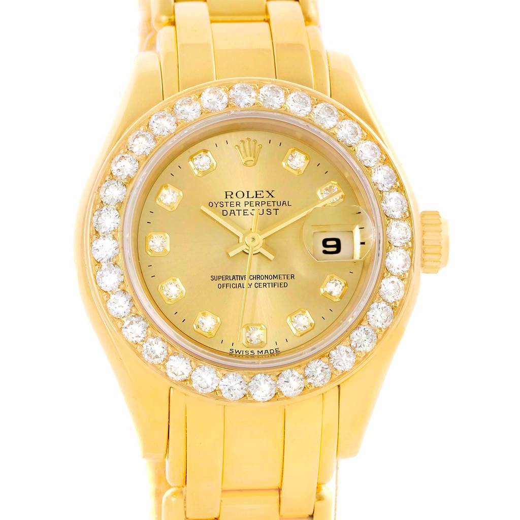 The Rolex Pearlmaster 69298 Women's Yellow Gold Champagne Dial 69298 Women's Yellow Gold Champagne Dial watch is shown from a top-down view, highlighting its diamond-encrusted bezel, gold dial, and bracelet.
