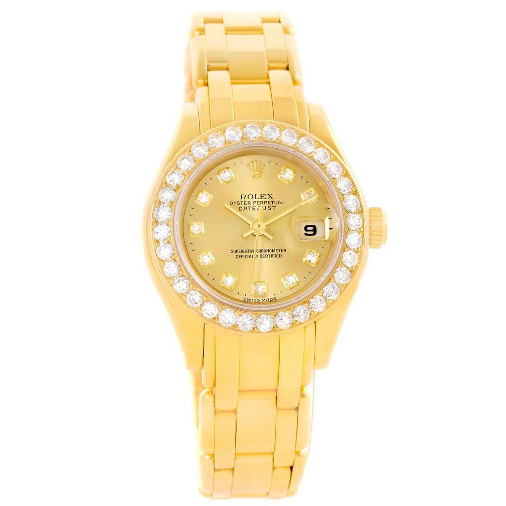 The Rolex Pearlmaster 69298 Women's Yellow Gold Champagne Dial 69298 Women's Yellow Gold Champagne Dial watch is shown from a top-down angle, highlighting its golden case, diamond bezel, dial, and bracelet.