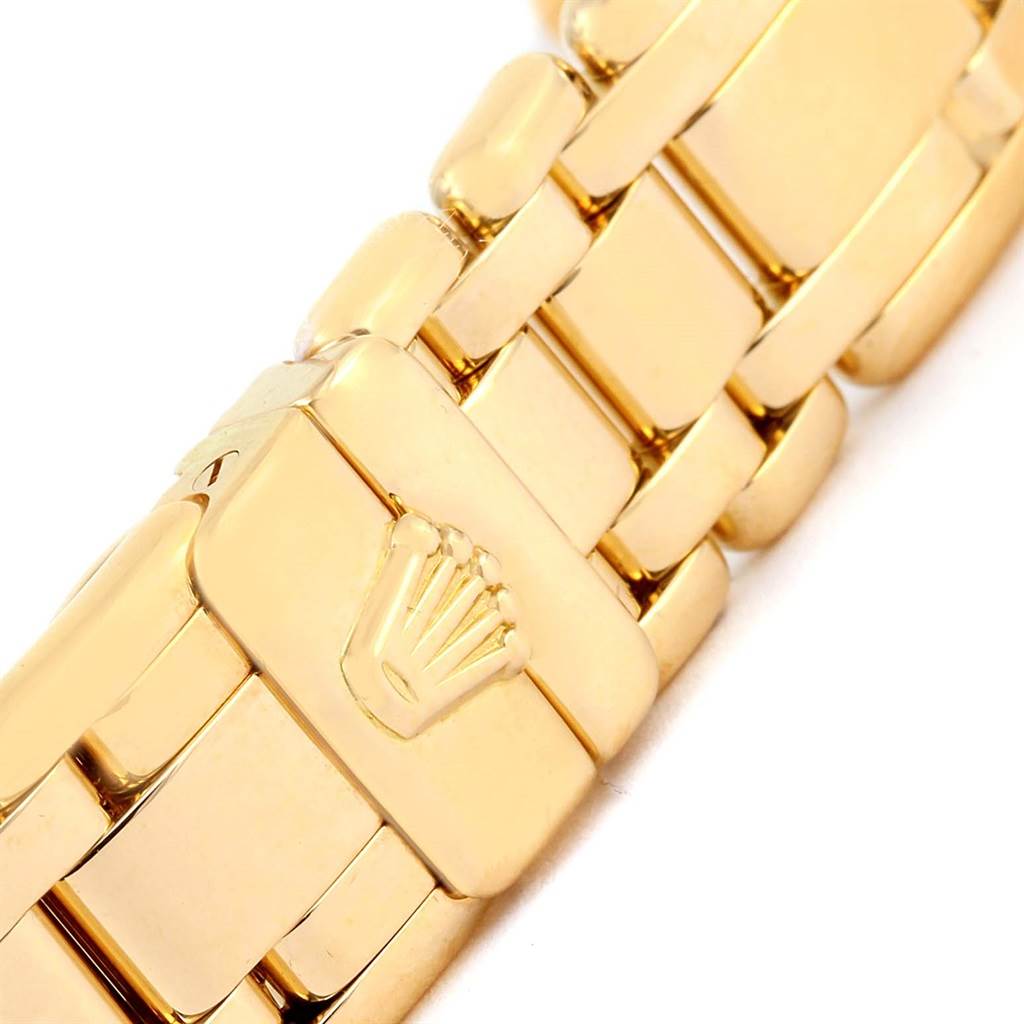This image shows a close-up of the bracelet clasp of a Rolex Pearlmaster 69298 Women's Yellow Gold Silver Dial 69298 Women's Yellow Gold Silver Dial watch, featuring the Rolex logo.