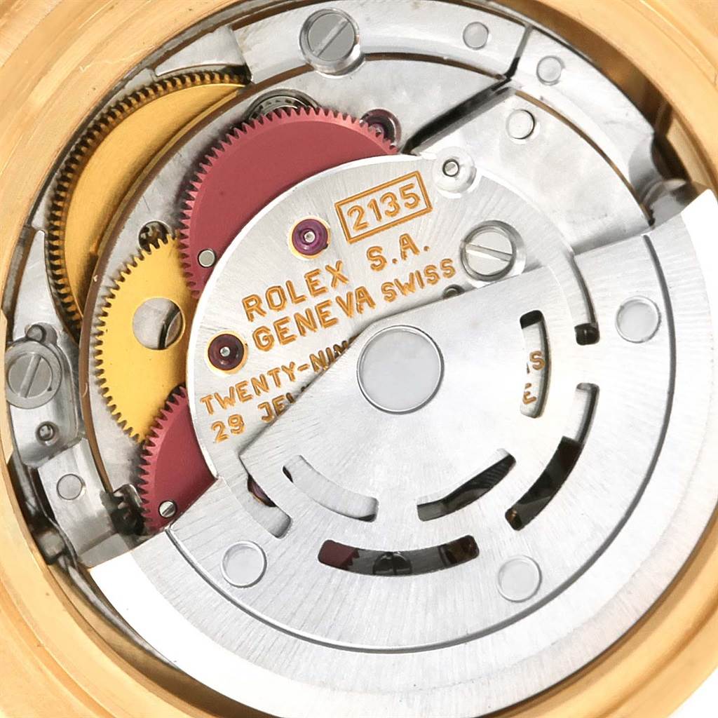 This image shows the intricate internal mechanism of the Rolex Pearlmaster 69298 Women's Yellow Gold Silver Dial 69298 Women's Yellow Gold Silver Dial model, highlighting the gears and rotor.