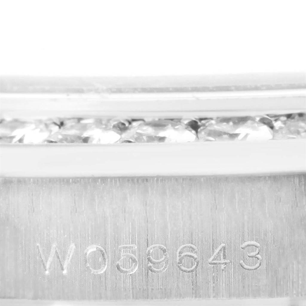 This image shows a close-up, side angle of the Rolex Pearlmaster 69298 Women's White Gold Mother of Pearl Dial 69298 Women's White Gold Mother of Pearl Dial watch, focusing on its serial number and diamond accents.