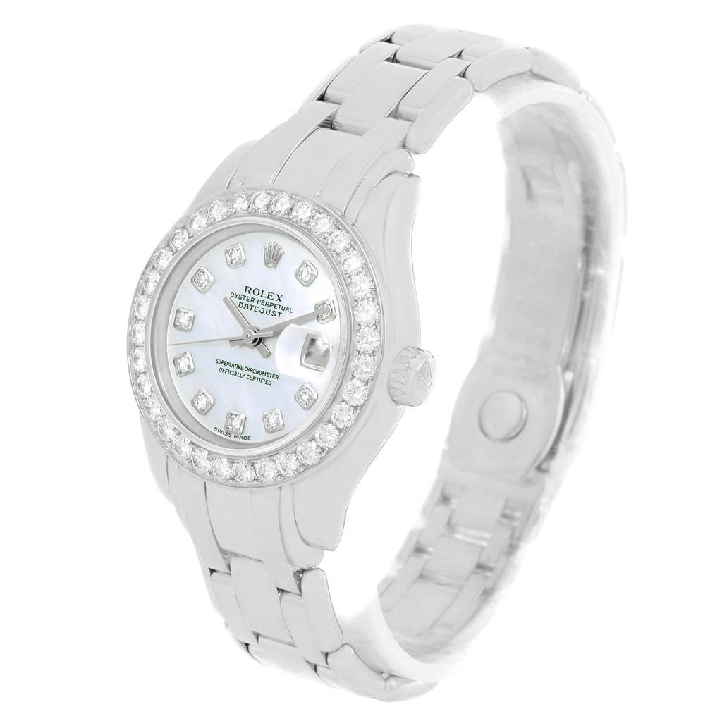 The Rolex Pearlmaster 69298 Women's White Gold Mother of Pearl Dial 69298 Women's White Gold Mother of Pearl Dial watch is shown at a slight angle, displaying its diamond bezel, silver bracelet, and mother-of-pearl face.
