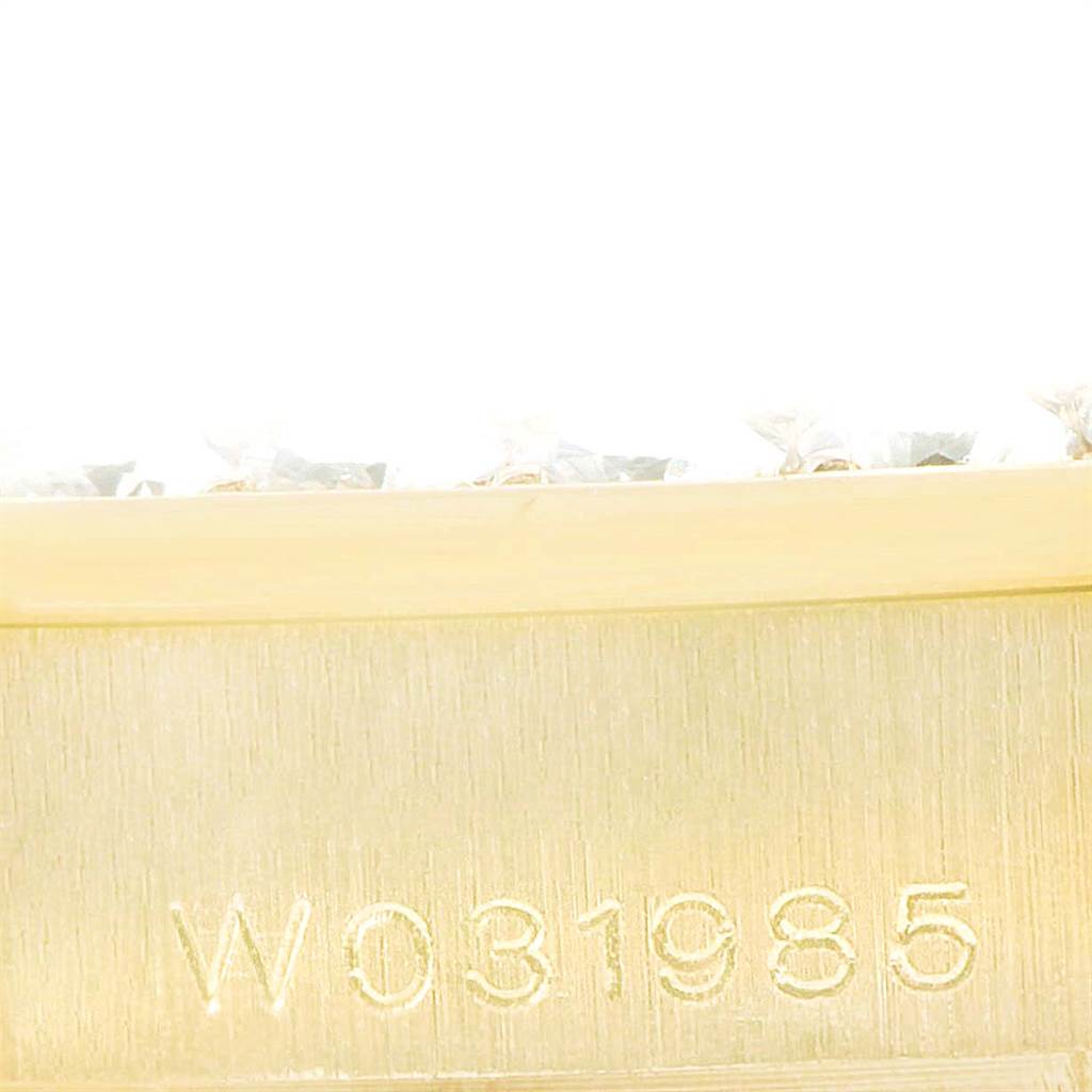 This close-up image shows the serial number on the band of a Rolex Pearlmaster 69298 Women
s Yellow Gold Mother of Pearl Dial 69298 Women
s Yellow Gold Mother of Pearl Dial watch.