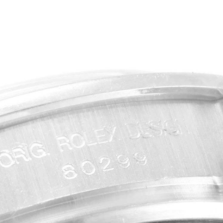 The image shows a close-up of the case back area of a Rolex Pearlmaster 80299 Women's White Gold White Dial 80299 Women's White Gold White Dial watch, featuring the engraved model number "80299."